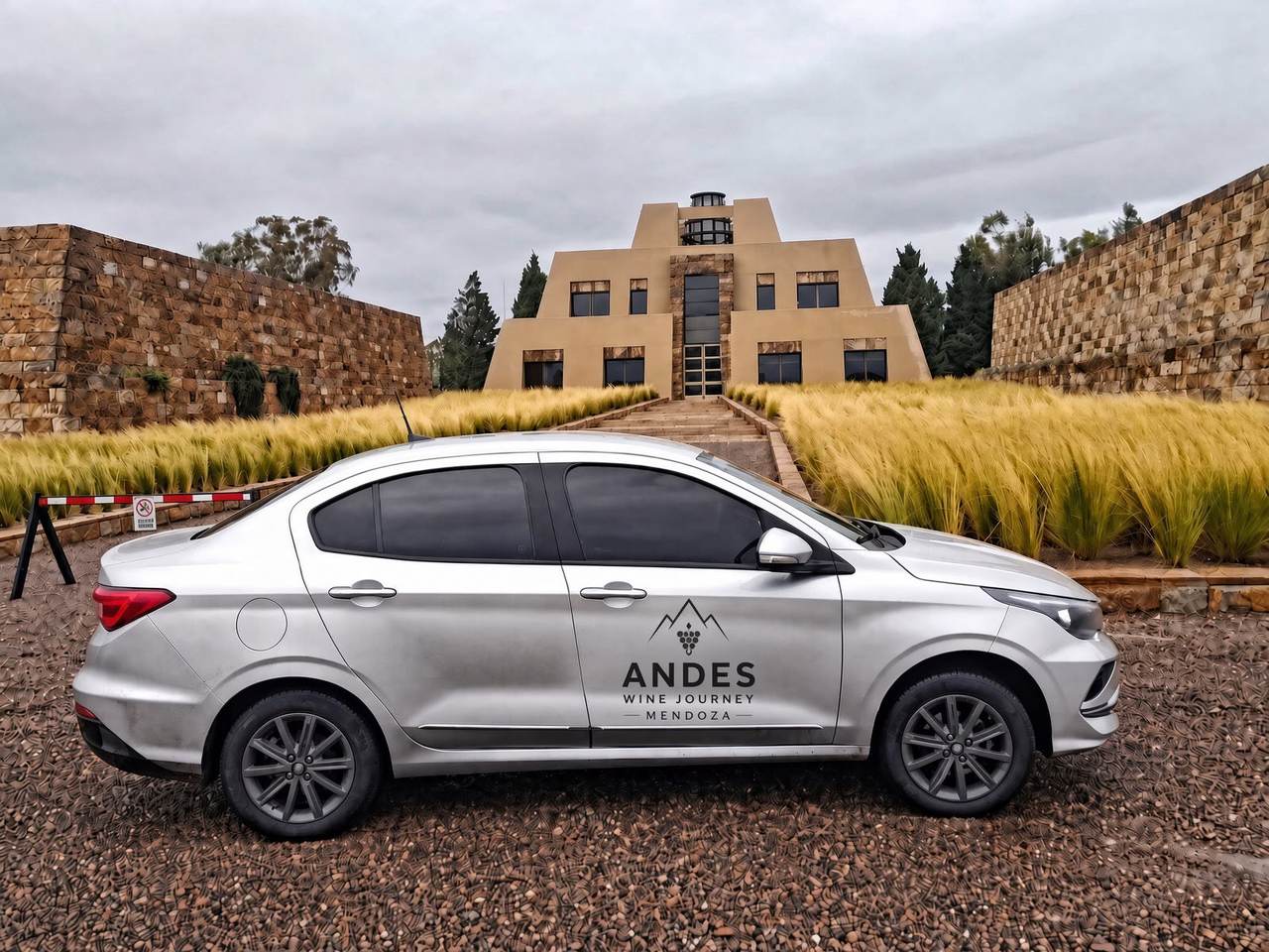Andes Wine Journey vehicle parked in front of a pyramid-shaped winery in Luján de Cuyo